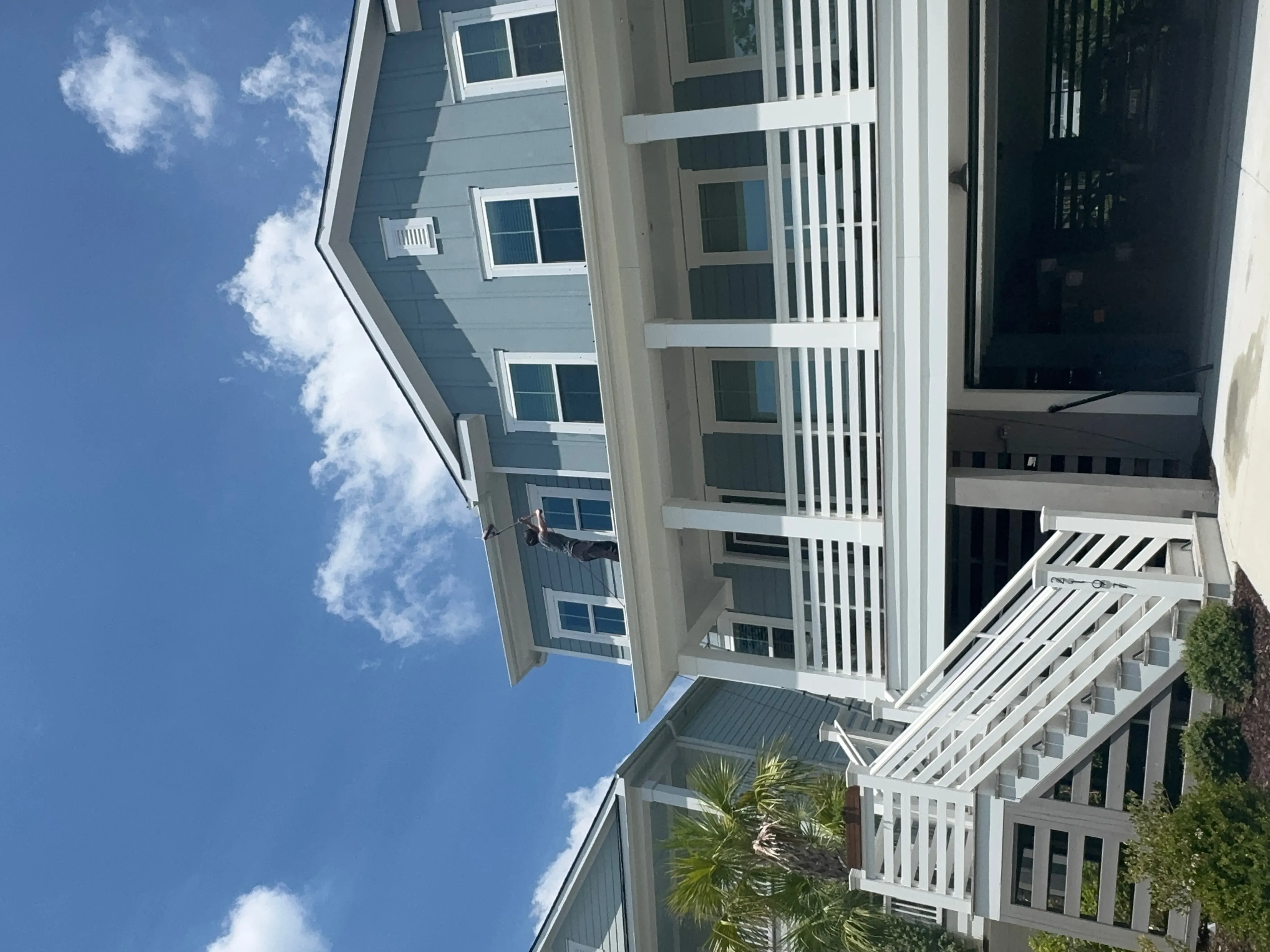 Window cleaning service on a house in Myrtle Beach SC by Home Services Express